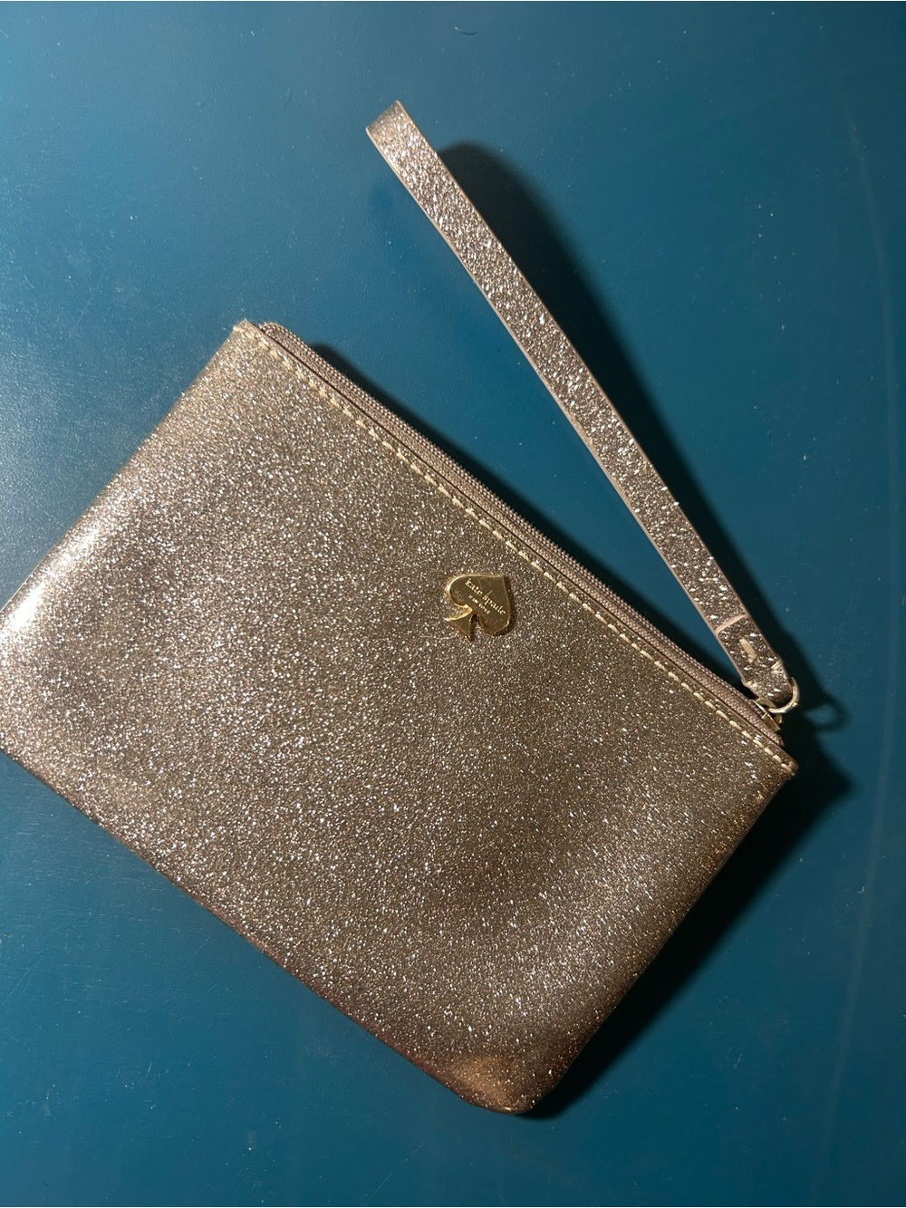 kate spade Silver Glitter Wristlet Clutch with Strap with Gold logo